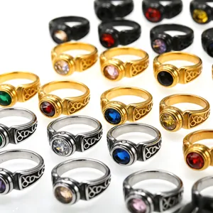 Macro detail of various vintage stainless steel rings for men with colorful gemstone accents