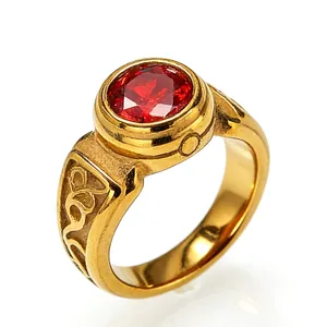 Macro view of a retro style gold-plated men's ring featuring a large round red gemstone