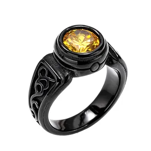 Macro detail of a vintage black titanium steel ring with a faceted yellow gemstone