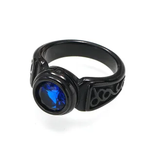 Detailed macro view of vintage men's titanium steel ring with a large blue gemstone