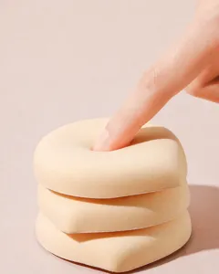 Close-up of soft marshmallow makeup puff showing high rebound and thick texture