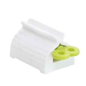 Witte en groene handmatige tandpastapers voor het efficiënt legen van al uw tubes