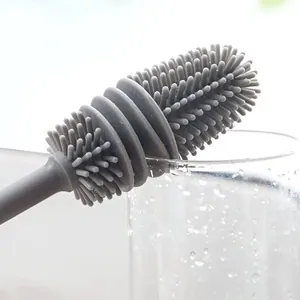 Grey silicone cup brush with long handle for 360-degree cleaning and gap stain removal