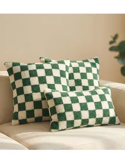 Close-up detail of soft green and white checkered sherpa fleece throw pillow covers