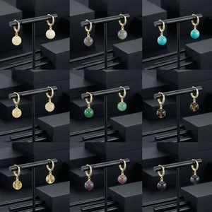 Detailed collage of gold-plated hoop earrings with various semi-precious stone drops