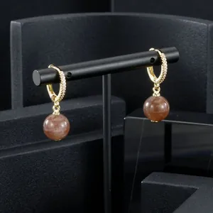 Elegant gold-plated hoop earrings with brown semi-precious stone drops and CZ pave.