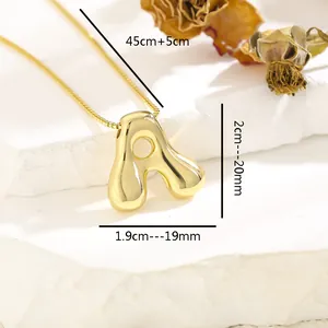 Macro view of golden bubble letter A pendant necklace with detailed size measurements