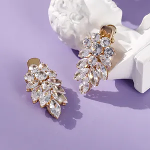 Elegant gold-tone hair clips with sparkling zircon leaf design for bridal and formal wear
