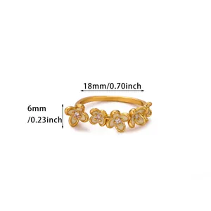 Close-up of gold floral open ring with white enamel petals and 18mm size details