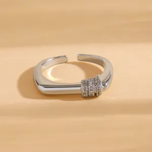 Detailed view of silver-plated open ring featuring sparkling cubic zirconia stones