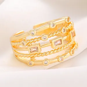 Detailed view of an elegant gold-plated multi-layer ring featuring sparkling white zircon inlays