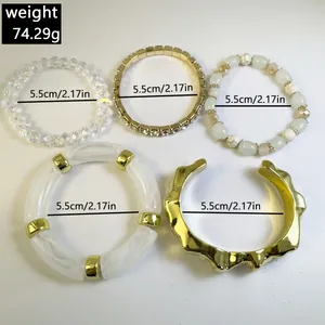 Detailed view of 5-piece acrylic and beaded bracelet set with weight and size info