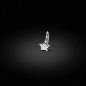 Close-up of a silver star-shaped nose stud with a polished straight bar