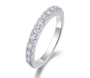 Close-up of elegant S925 sterling silver moissanite eternity ring with micro-pave setting.
