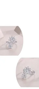Primo piano di anello in moissanite a forma di girasole con fascia in argento brillante.