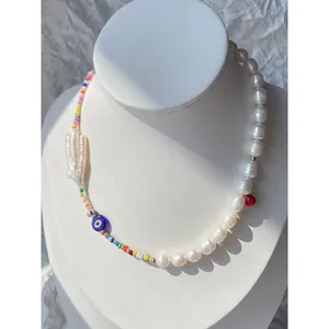 Detailed view of Evil Eye necklace with colorful seed beads and freshwater pearls