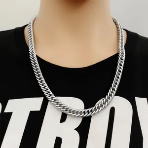 Close-up detail of silver stainless steel chunky Cuban link chain necklace for men.
