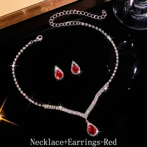 Detailed shot of red teardrop zircon necklace and earrings bridal jewelry set