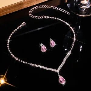 Detailed view of pink teardrop zircon necklace and earrings bridal jewelry set