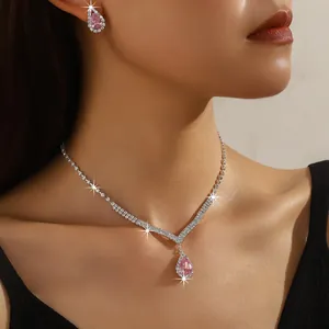 Elegant jewelry set featuring pink pear-shaped zircon necklace and matching earrings