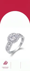 Detail view of a moissanite halo engagement ring in 925 sterling silver with pavé band