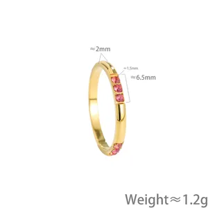 Detailed macro view of gold titanium steel ring with pink stones inlay weight 1.2g