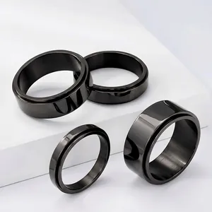 Detailed view of black stainless steel spinner rings in various widths from 4mm to 10mm