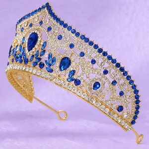 Luxurious vintage gold wedding tiara adorned with elegant blue crystals and rhinestones