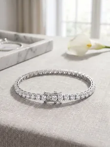 Macro detail of S925 silver tennis bracelet with round Moissanite and secure clasp