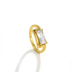 Close-up of a minimalist 18k gold-plated ring with a square-cut clear zircon