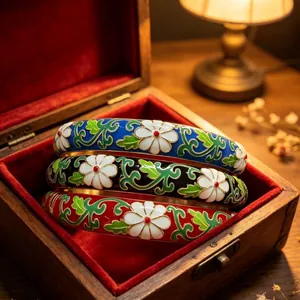 Elegant Chinese style cloisonne enamel bangles with flower patterns in a gift box.