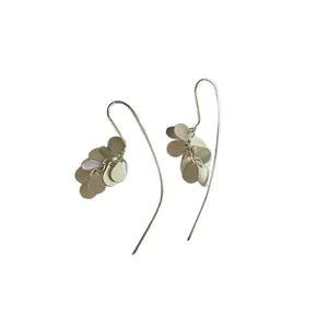 Detail view of silver drop cluster earrings with long elegant curved hooks