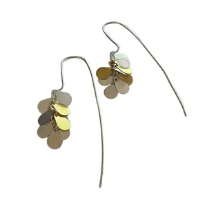 Detailed view of modern mixed metallic teardrop petal dangle earrings with long hook