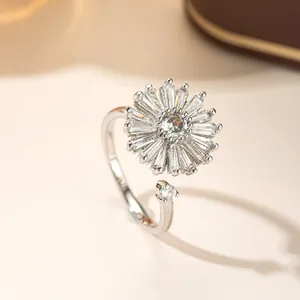 Rotating sunflower ring with sparkling zircon stones in an adjustable open design.