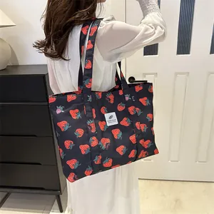 Casual dark blue nylon tote bag with cute red strawberry print pattern