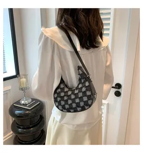 Elegant black and white checkered crescent-shaped underarm shoulder bag for women detail view