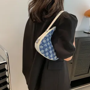 Stylish blue checkered denim crescent shoulder bag for women in minimalist chic style