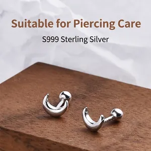 Minimalist S999 sterling silver crescent moon stud earrings with secure screw ball back.