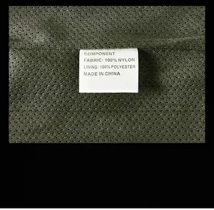 Close-up of men's jacket wash label showing 100% nylon fabric and mesh texture detail