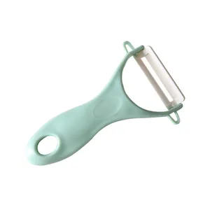 Ergonomic mint green ceramic fruit and vegetable peeler for efficient kitchen use