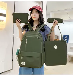 Detail view showing 4-piece olive green schoolbag set including backpack and tote bag