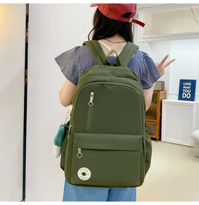 Military green large capacity backpack for students featuring a back-facing view
