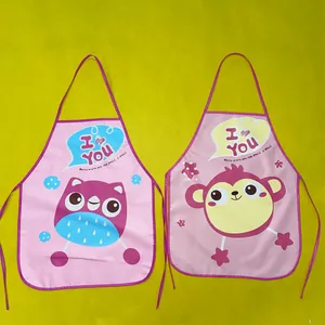 Detail of waterproof pink EVA children's aprons featuring cute owl and monkey cartoons