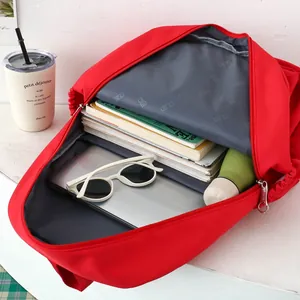 Minimalist large capacity red student backpack with interior storage for laptops