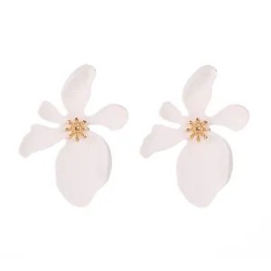 Detailed macro view showing the pleated texture and gold center of white lacquer flower earrings