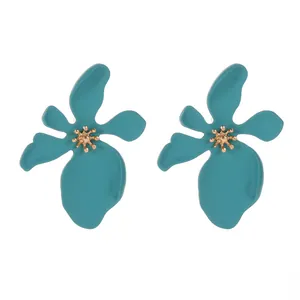 Vibrant teal lacquered flower earrings with gold-tone centers, exaggerated jewelry