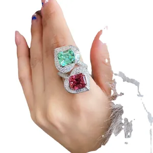 Luxuriöser Doppelherzring mit grünen und rosa Turmalinen und Vollkristallbesatz fein