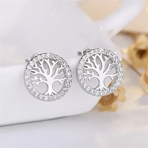 Close-up detail of Tree of Life circular stud earrings featuring sparkling pave crystals