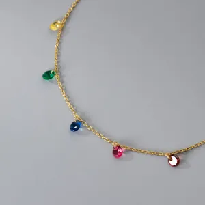 Dainty s925 silver bracelet with vibrant multi-color gemstones in a gold finish
