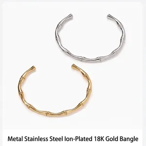 Brazaletes abiertos de acero inoxidable estilo bambú con chapado en oro y plata.